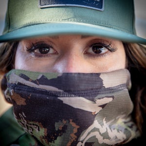 Camo and lashes, Rihana attempts to blend into her surroundings.