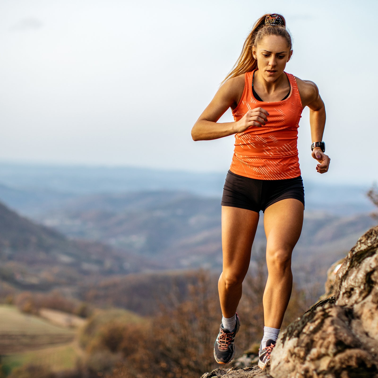 Young woman running on mountain