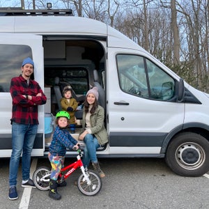 The family in front of their new van