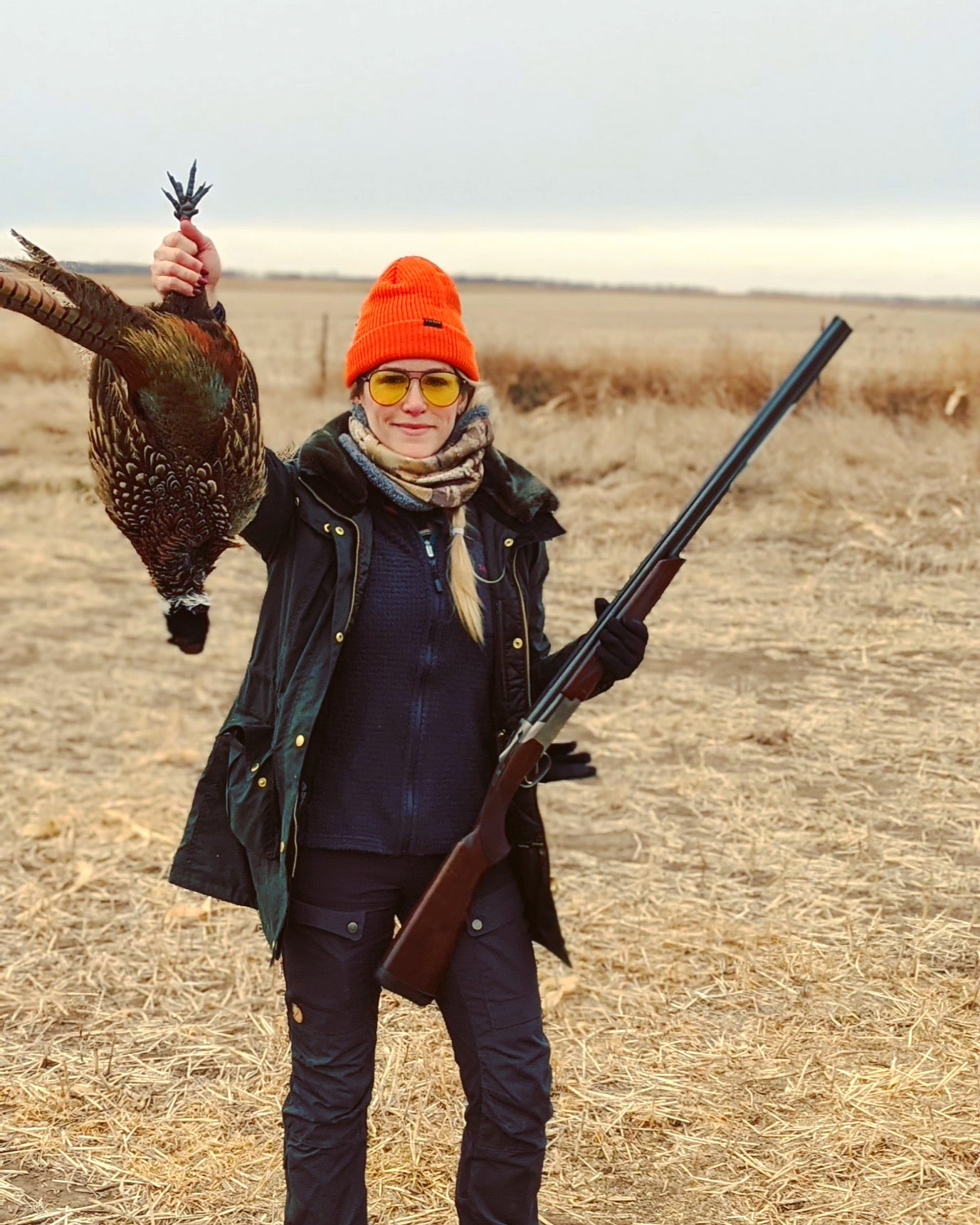 Virginia's first pheasant. She's shooting a 20 gauge Browning Citori, which is a perfect fit for her 5'2" frame. Not only do over-under shotguns like this one look handsome, they're easier to load and unload than a semi-auto, offering neophyte hunters more confidence that they're being as safe as possible.