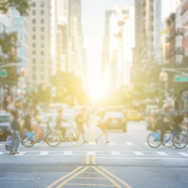 People crossing the busy intersection in Manhattan in New York City
