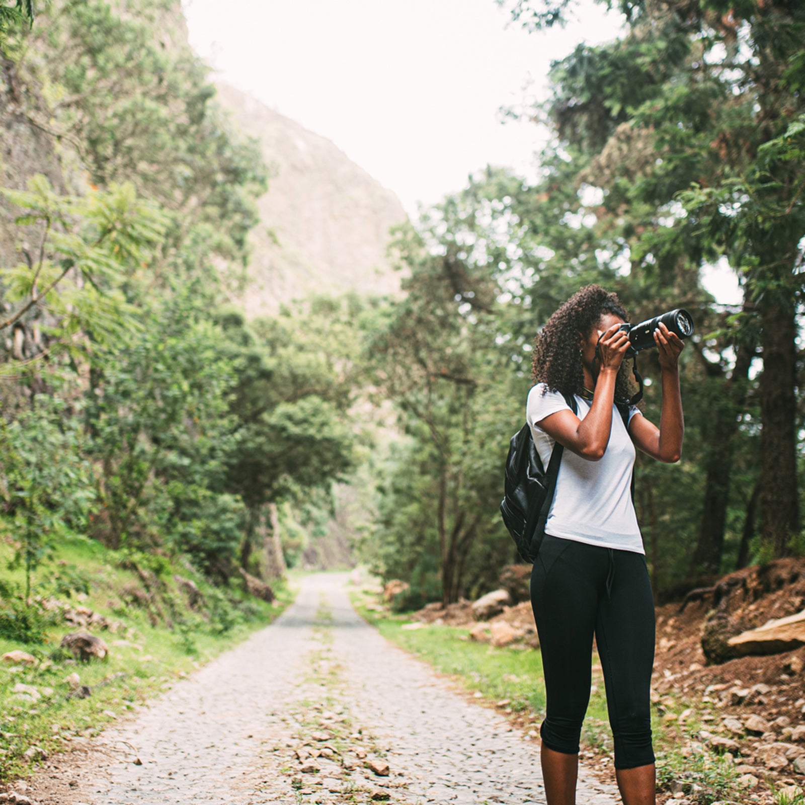Beautiful Black Woman With Camera Taking Photos