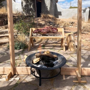Cooking meat above an open fire