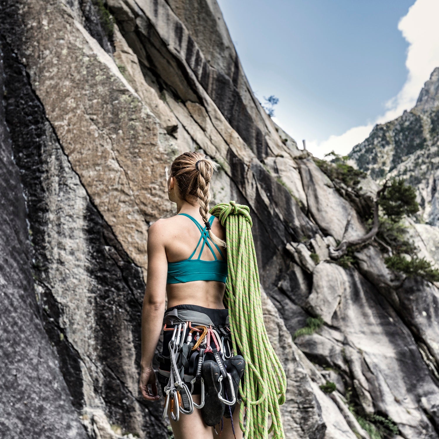 woman standing at wall base
