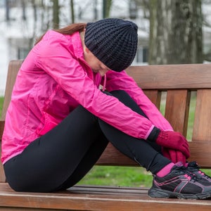 Tired runner on a bench