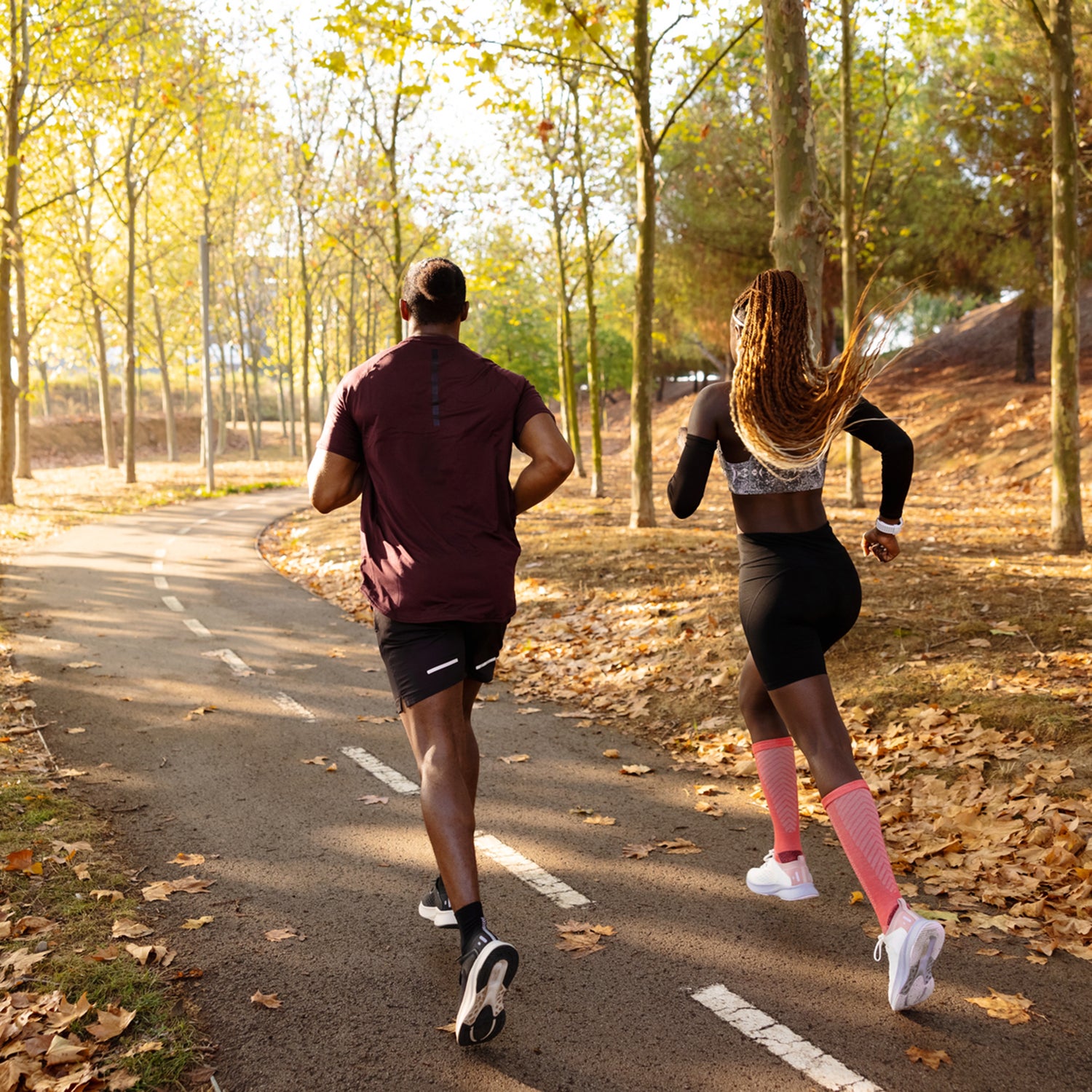 Athletes running through park