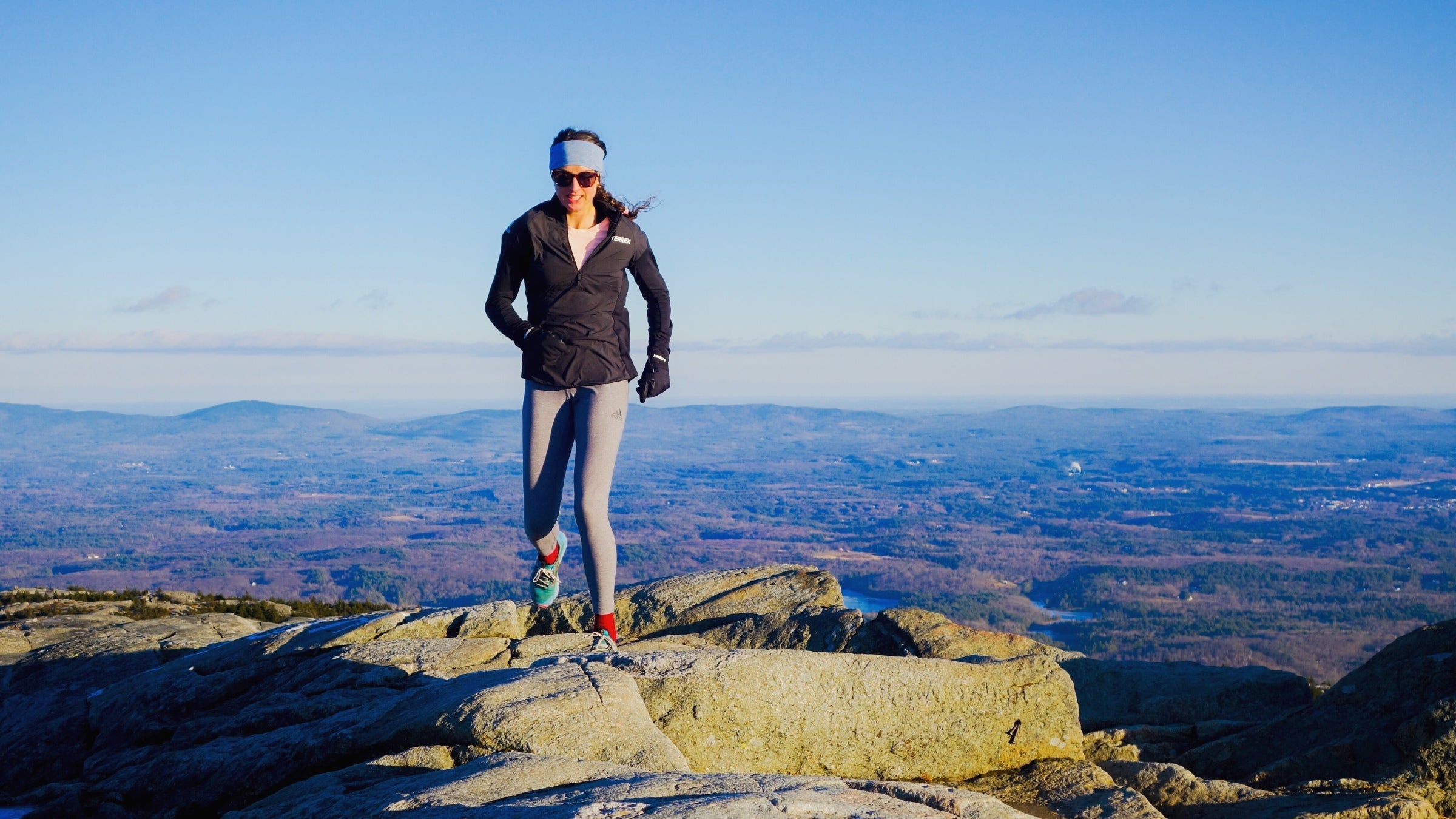 Abby Levene running on a mountain