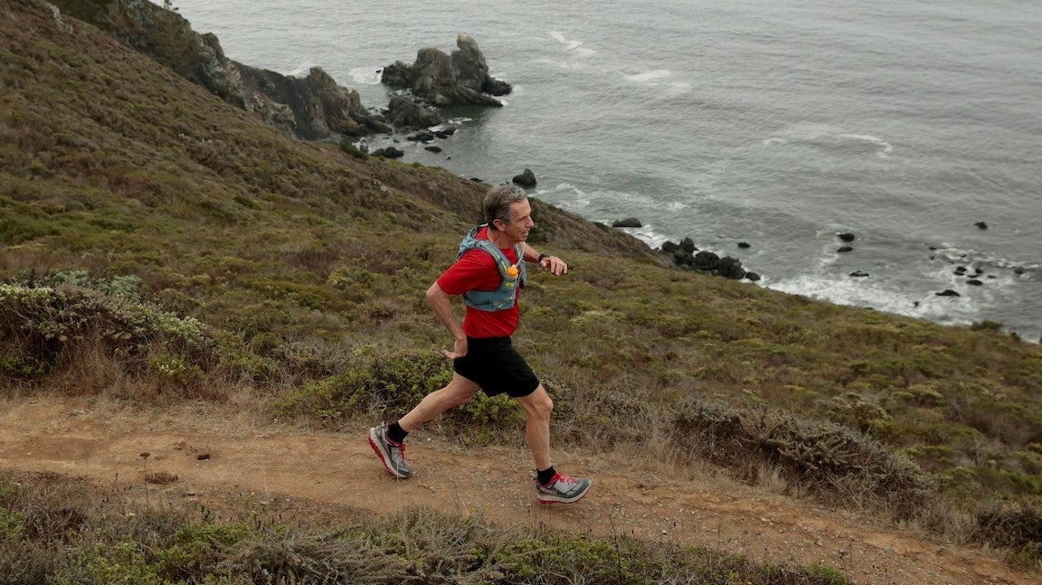 Eric Spector, ultramarathon runner running on Owl Trail in Muir Beach, California training for Western States 100 at age 74