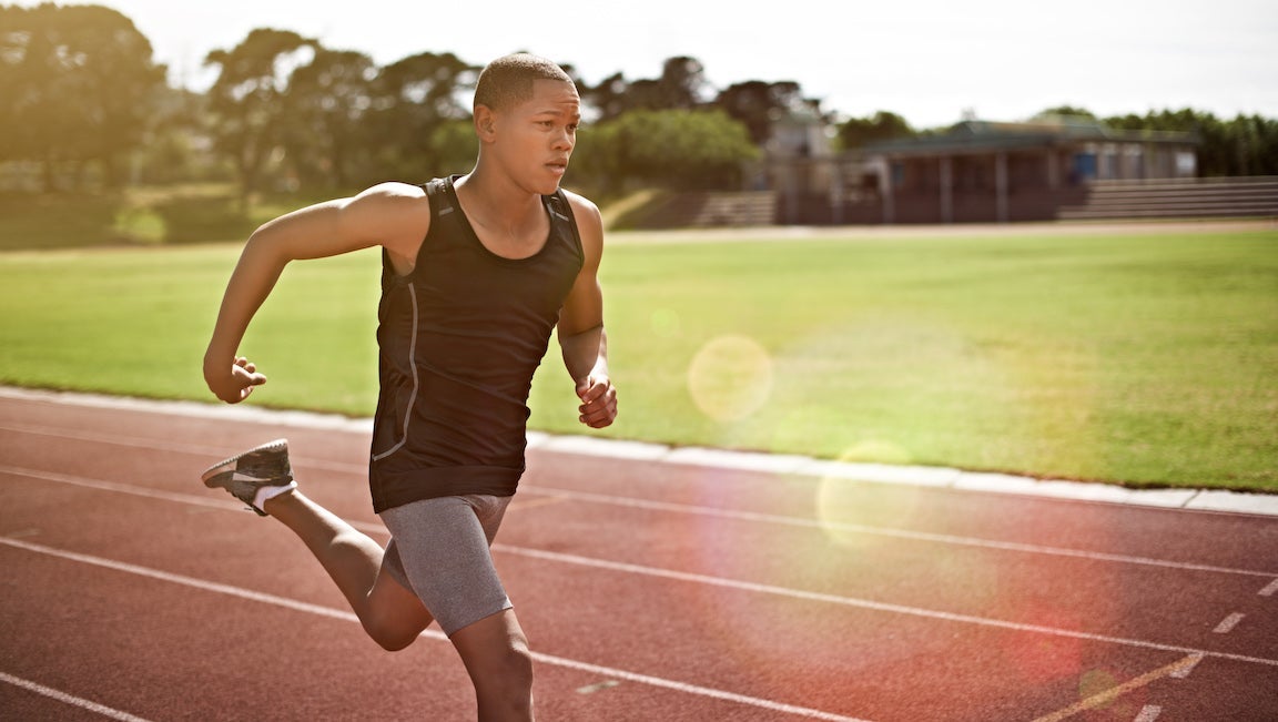 Shot of a young athlete out running on the track.