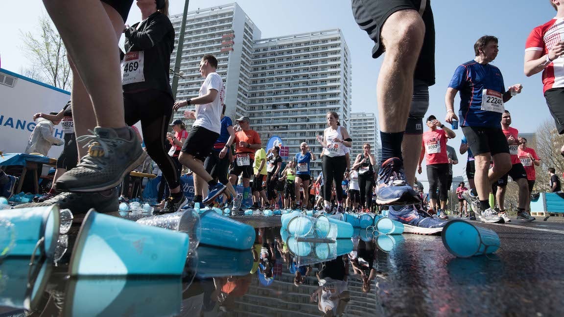 Plastic cups laying on the road during a half marathon race.