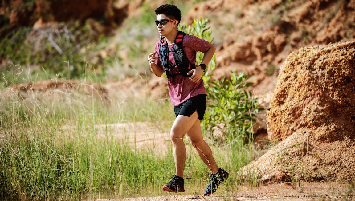 Man running on trail.