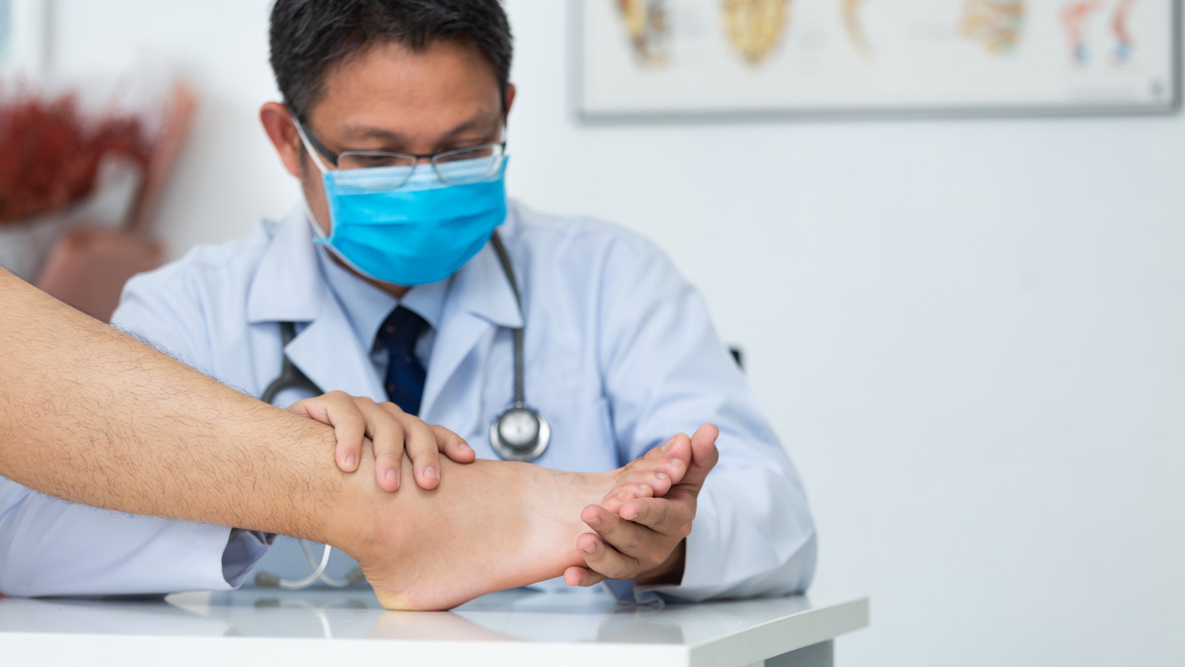 doctor examining foot for injury