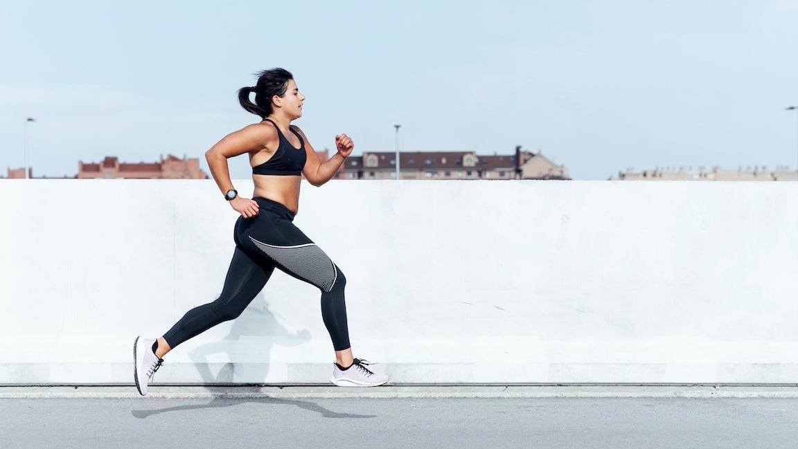 Young woman running training in the city.