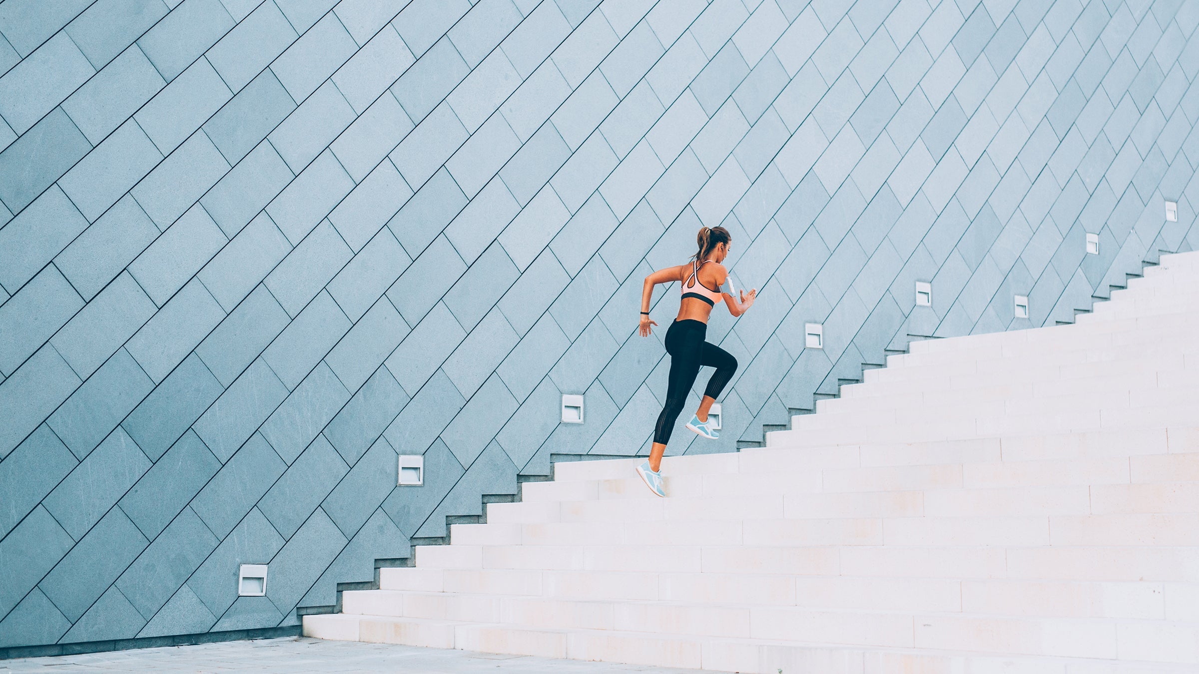 woman running up stairs