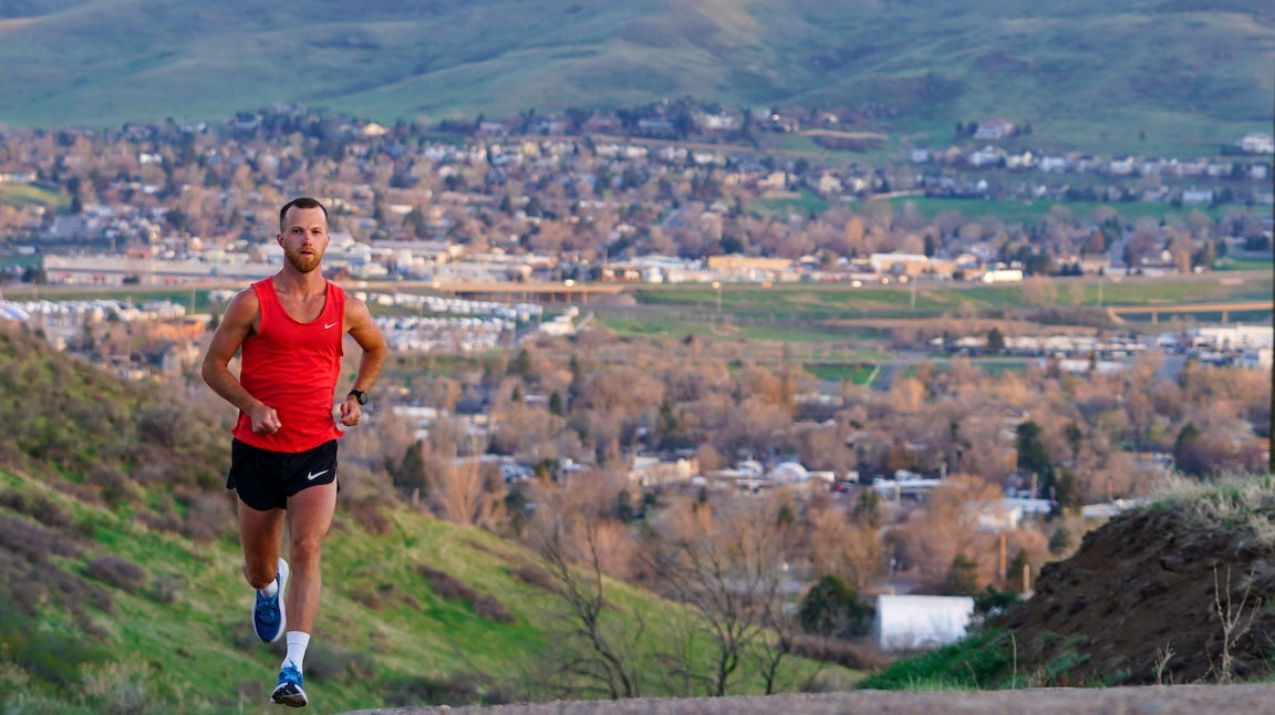 Man running in red shirt.