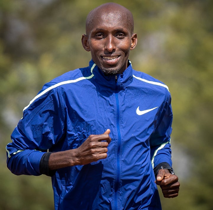 Abdi Abdirahman running and smiling