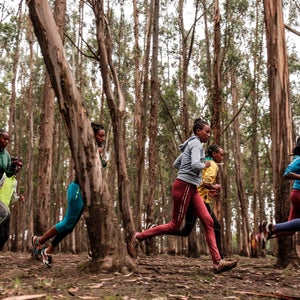 group of Ethiopian runners training in a forest