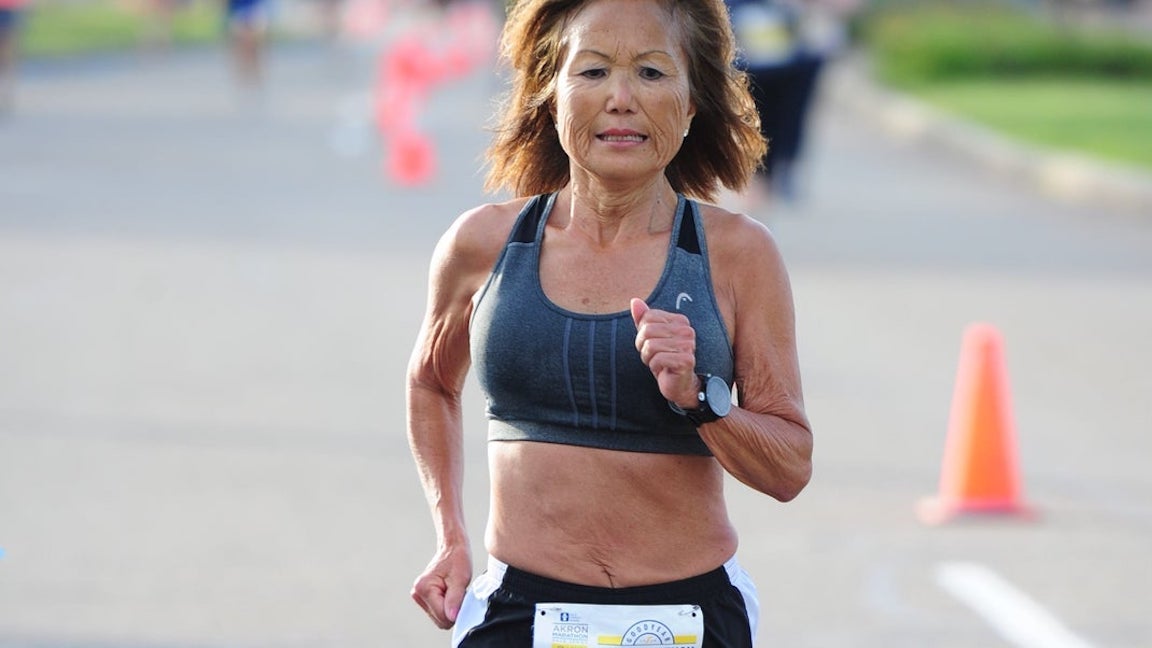 Woman running a road race
