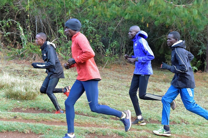 Eliud Kipchoge (2nd-L) runs during a morning training on March 17, 2017 in Kaptagat.