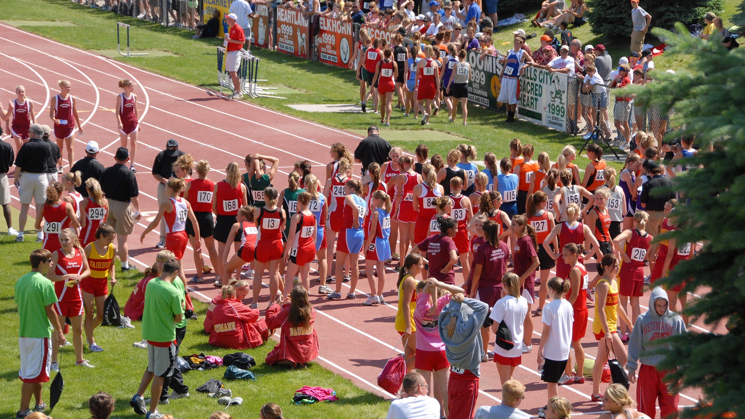high school girl runners line up for the mile at state meet