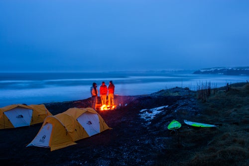 Timmy Turner, Sam Hammer, and Josh Mulcoy stand around a campfire in Iceland in 2008.