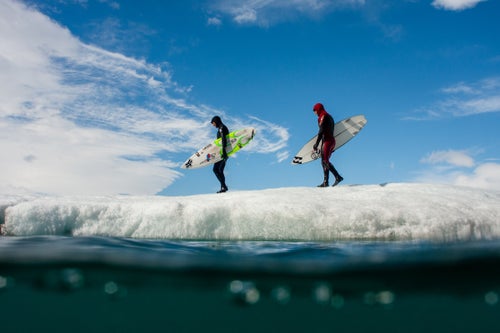 Josh Mulcoy and Sam Hammer walk on an Icelandic glacier en route to some waves in 2008.
