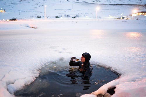 Sam Hammer enjoys a cold one after a long day of surfing in 2016.