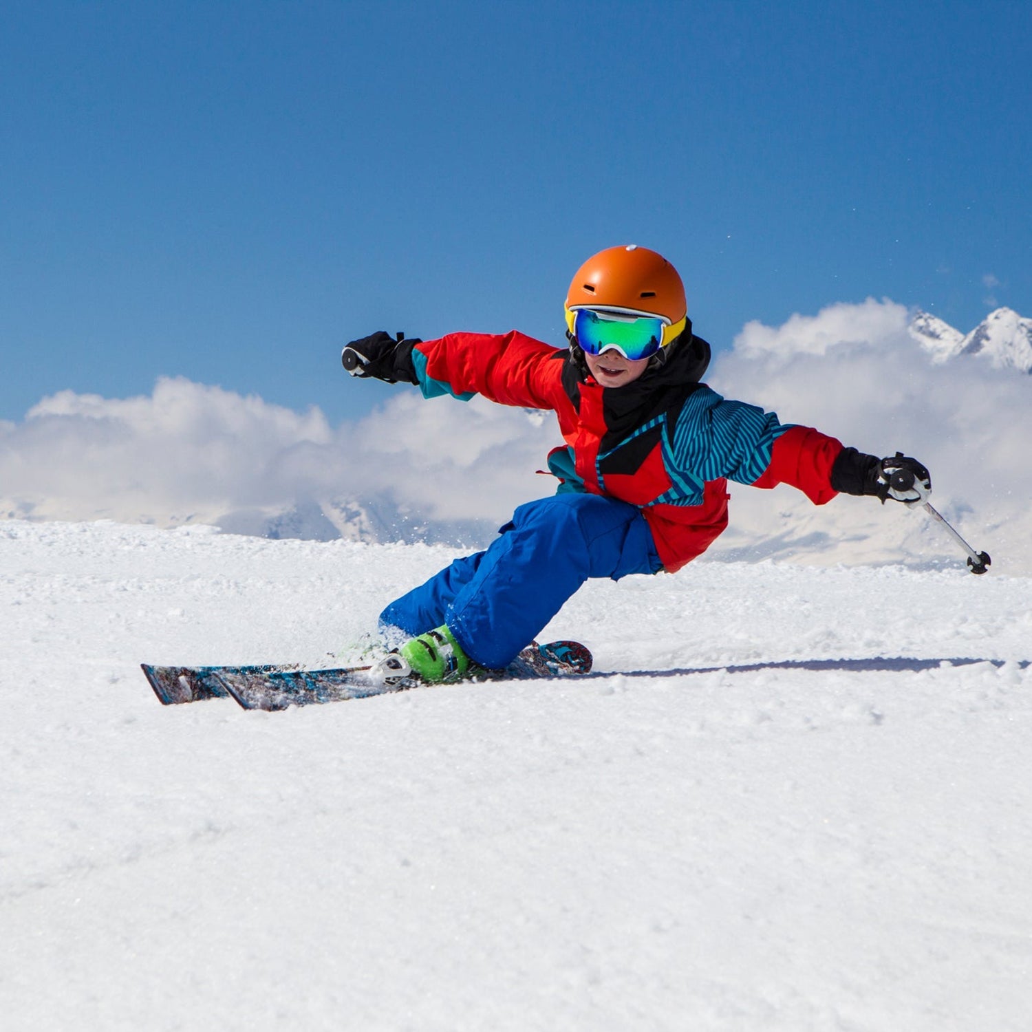 Kid carving on skis