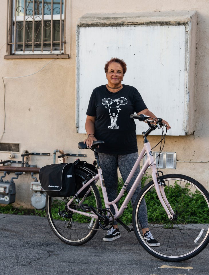 Yolanda Davis-Overstreet standing with bike