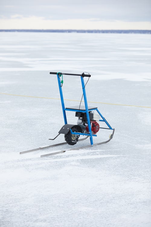 A small motorized sled was used to ferry people and gear from the race site back to the dock on shore.