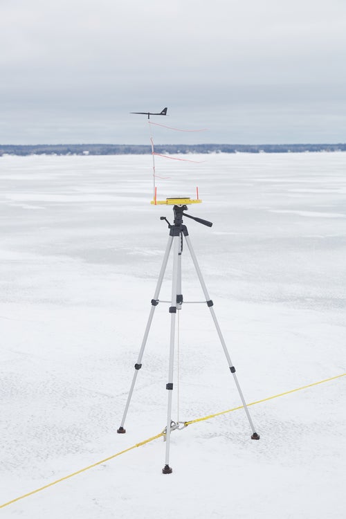 An instrument measures the wind direction at the starting line before a race during the INDIYRA 2021 U.S. Nationals.