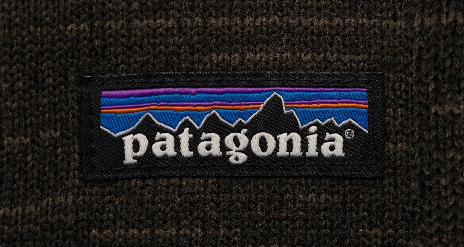 Patagonia logo on a brown shirt