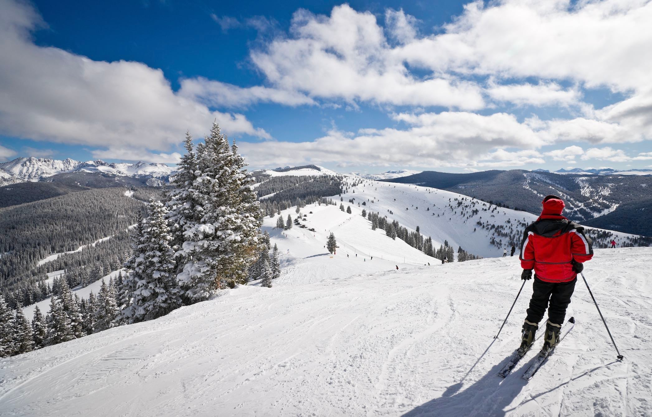 Skier standing at the top of Vail Resort