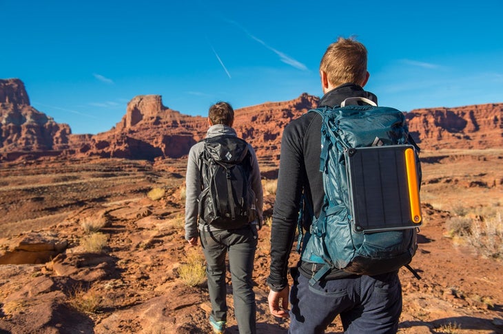 biolite SolarPanel10+_lifestyle_4 Two hikers in the desert with a BioLite Solar Panel strapped to one's backpack.