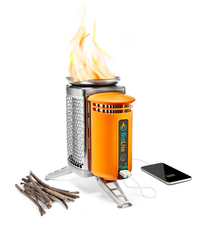 BioLite_TwigsAndPhone6 Biolite Camp Stove with pile of twigs, iPhone, flames