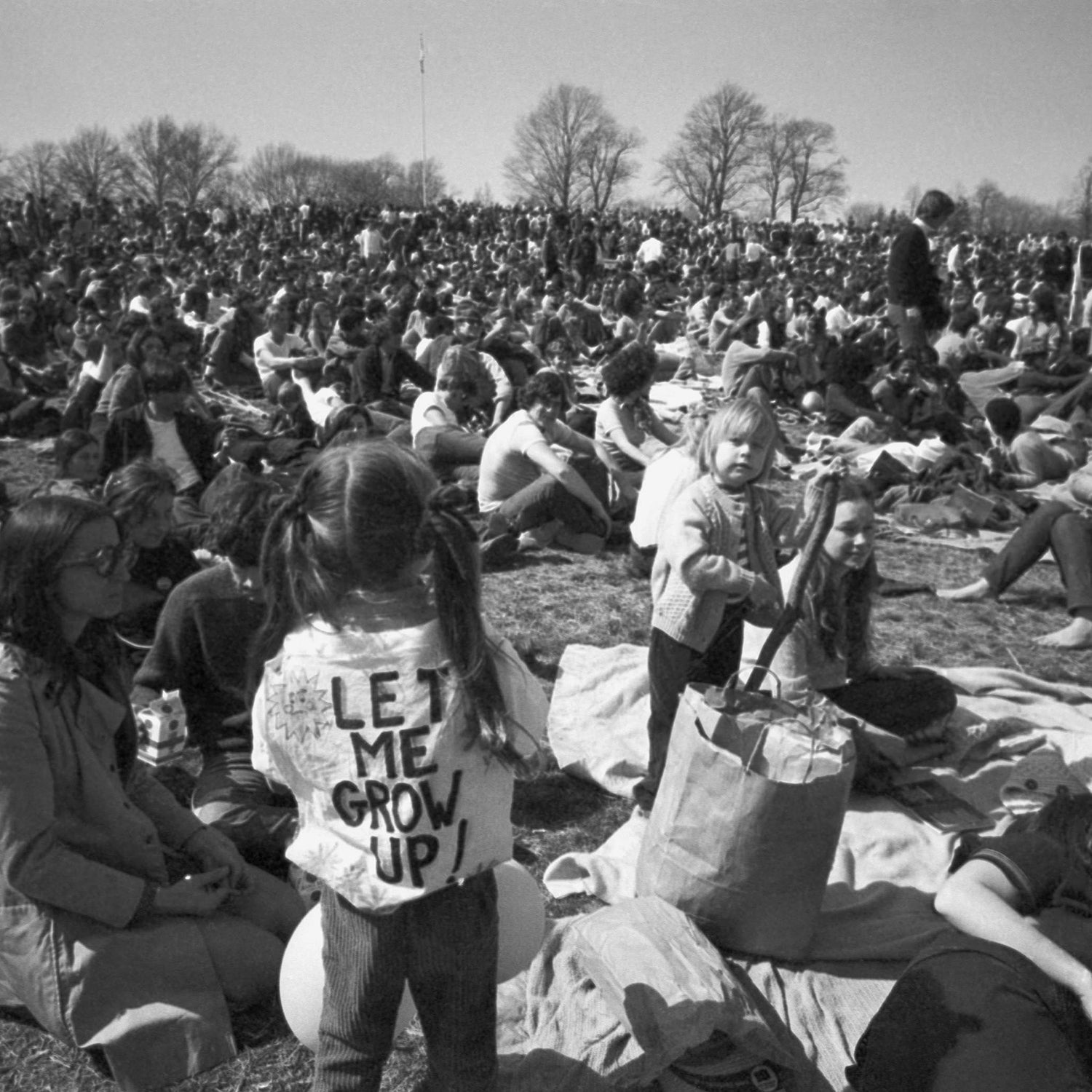 April 23, 1970, file photo, part of crowd observing Earth Day, including, youngster wearing