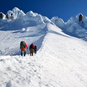 Three climbers ascend the Hogsback Route on Mt. Hood
