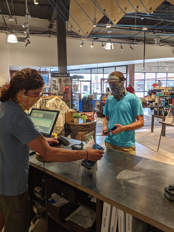 Neptune masked cashier and customer None