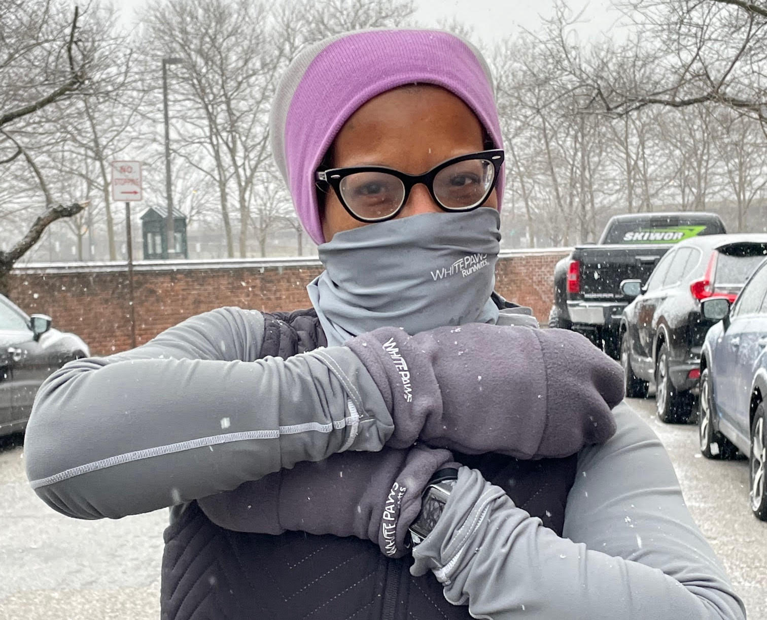 Woman wearing mittens in snow