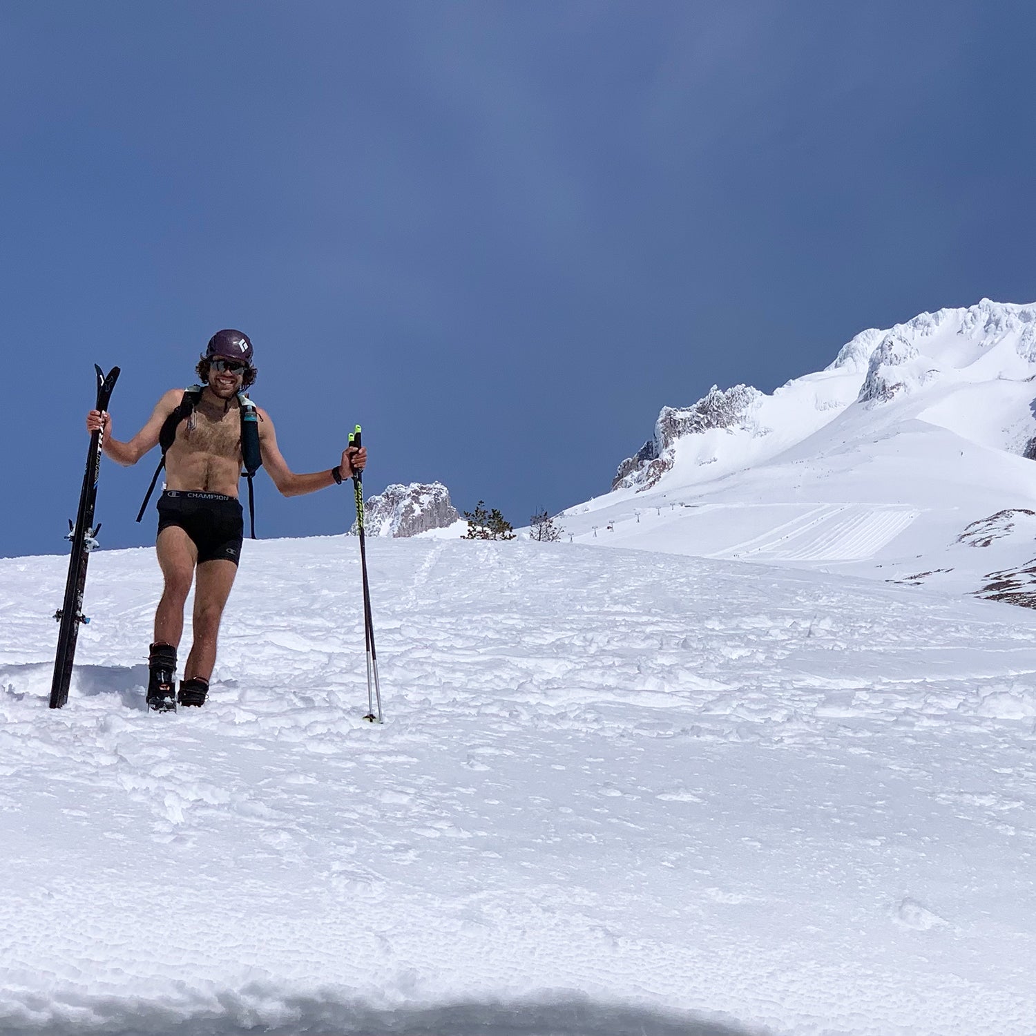Jack Kuenzle with skis near the top of a mountain
