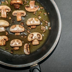 Mushrooms cooking in a pan