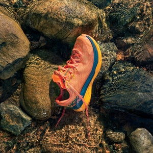 Outside Gear Guide cover image: Hoka trail running shoe on rocky background