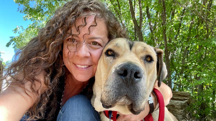 Mattie Allen with Porky, a mother of seven who survived the Camp Canyon–Hermit’s Peak fire