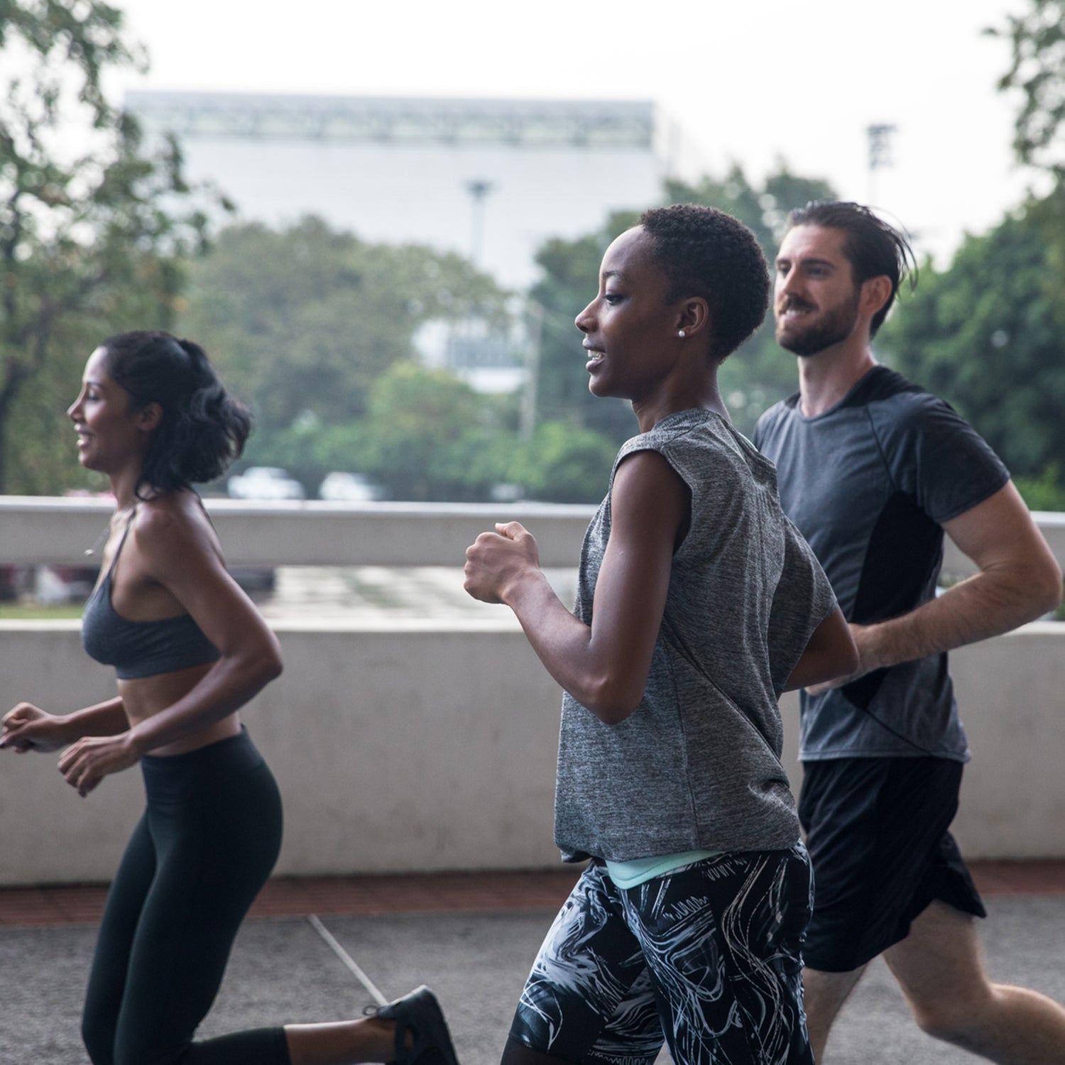 Three Friends Exercising Together, outside in the city