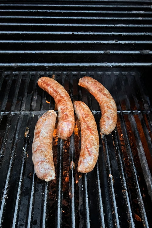 Merguez sausages on Ogbonna’s grill