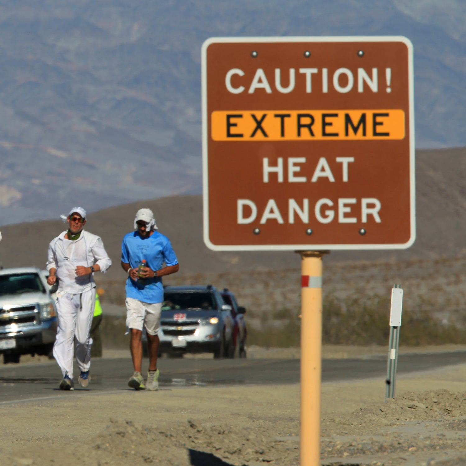 Runners on the road in Death Valley competing in the Badwater Ultramarathon