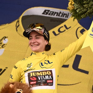 Team Jumbo Visma's Dutch rider Marianne Vos celebrates her overall leader yellow jersey on the podium at the end of the 2nd stage of the new edition of the Women's Tour de France cycling race
