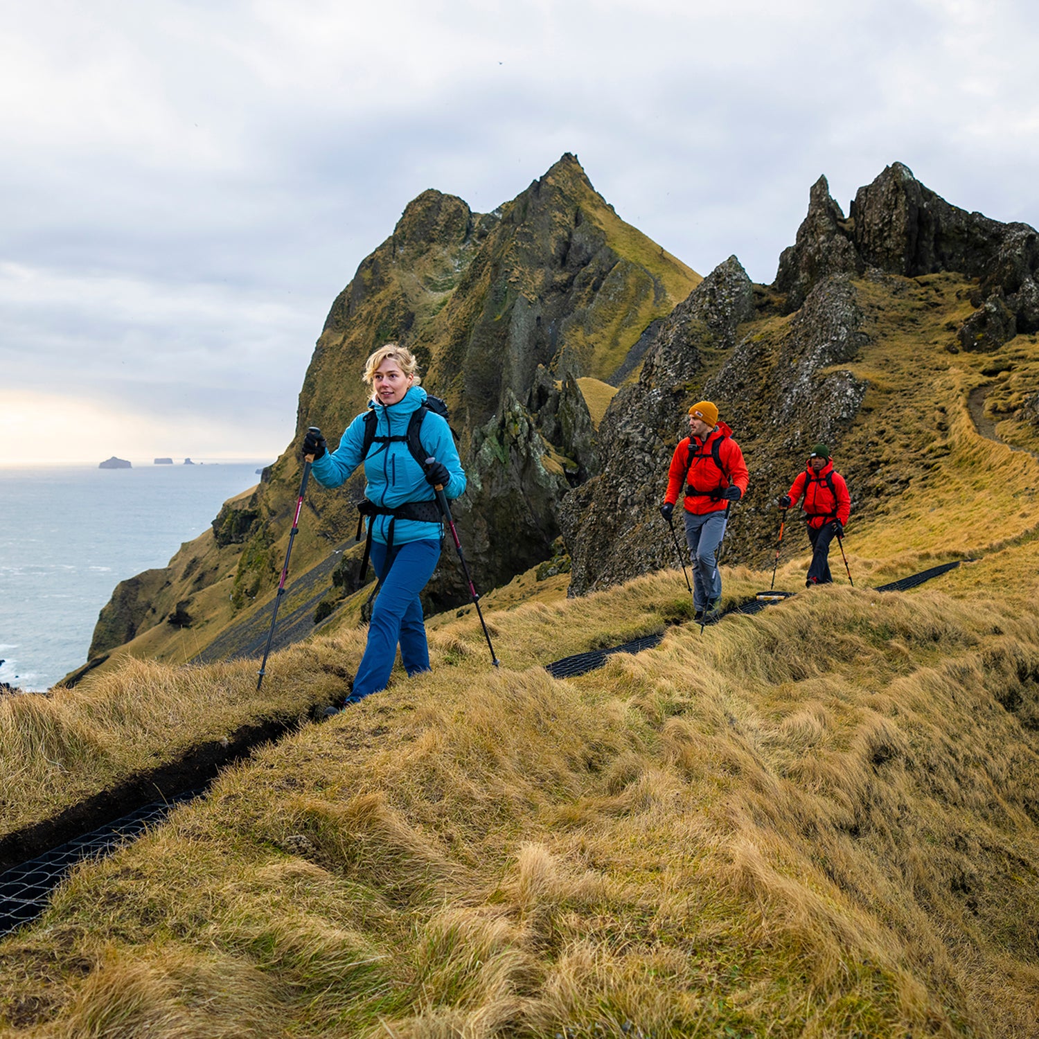Hikers make their way across a ridge in Iceland