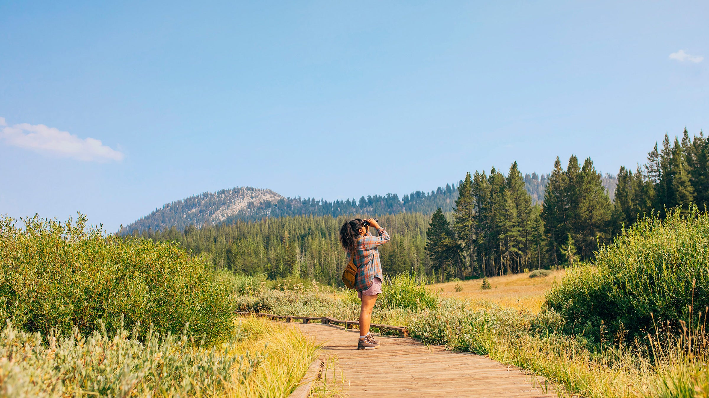 Hiker gazing up at the sky from a trail in Reno