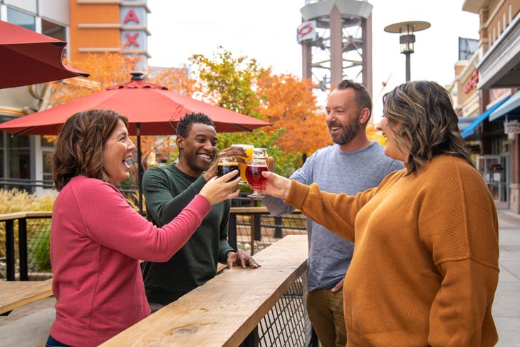 Four adults drinking beer at a Reno Brewery